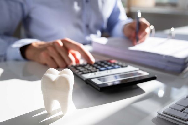 dentist working out finances for restart