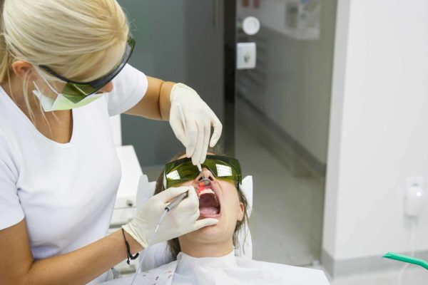 dental therapist working on patient