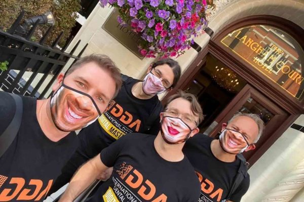 A dentist is making customised face masks and gowns in a bid to cut plastic waste and raise money for charity