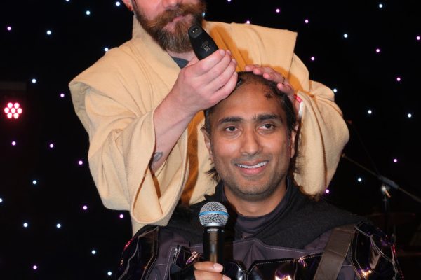 Amit having his hair cut at the ADI congress