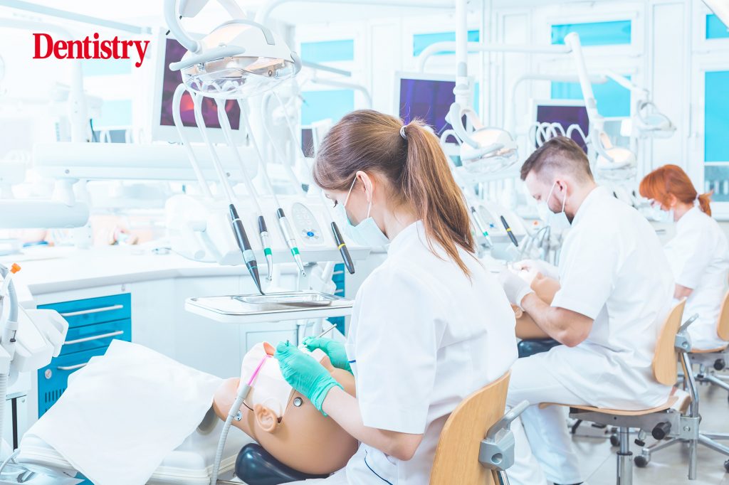 Dental students practising clinical skills on mannequins during dental school training