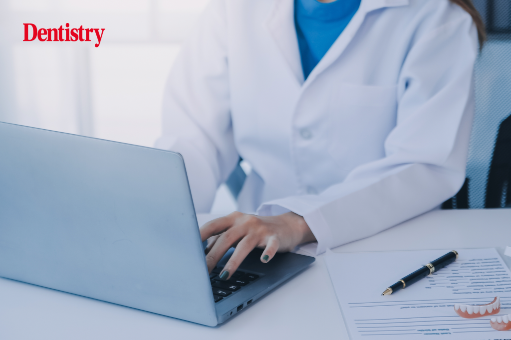 Current image: Dental professionals reviewing a dental X-ray image on a laptop screen. dentist struck off GDC