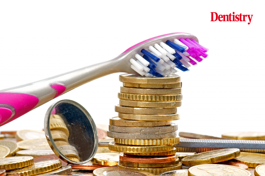 Current image: dentist earnings sit underneath a toothbrush