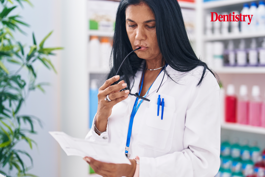Current image: A pharmacist looks at a disallowed dental prescription. More than 5,000 dental prescriptions were disallowed in a one year period