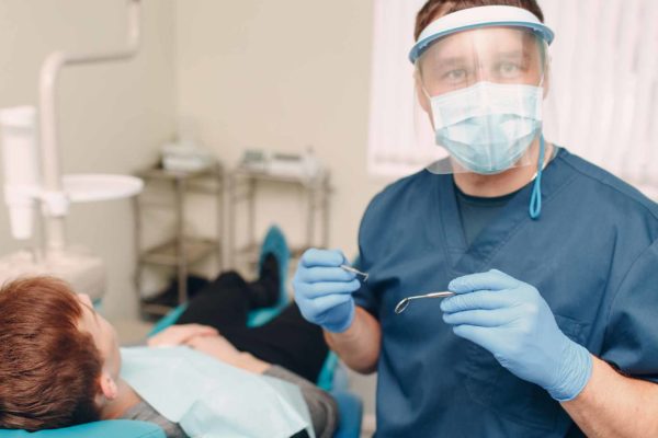 Dentist working at a UDC