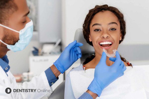 hygienist offering invisalign treatment