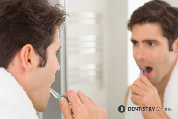 Men are less likely to brush their teeth or floss as frequently as women, it has been revealed